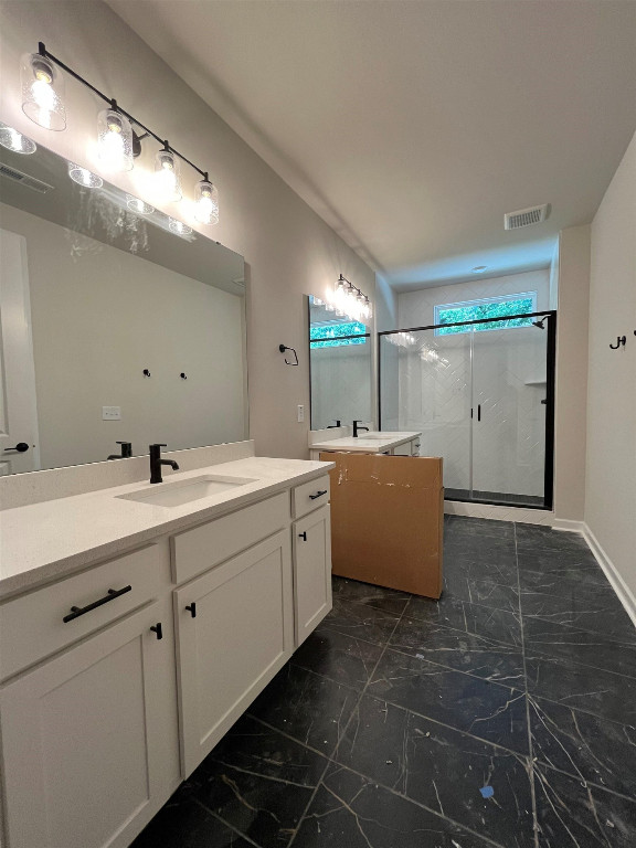 Undisclosed Address Raleigh, NC 27617 - Photo 14 of 37 a bathroom with a double vanity sink mirror and bathtub