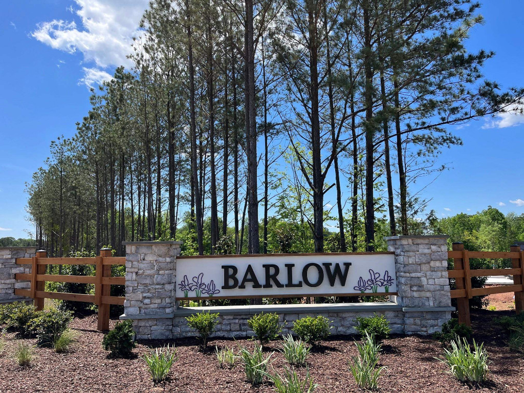 Undisclosed Address Raleigh, NC 27617 - Photo 16 of 37 a sign that is sitting in front of a brick building