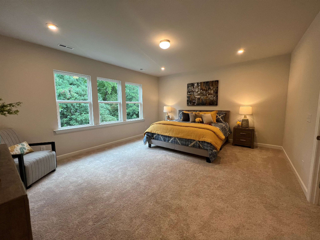 Undisclosed Address Raleigh, NC 27617 - Photo 36 of 37 a bed room with a bed and a couch