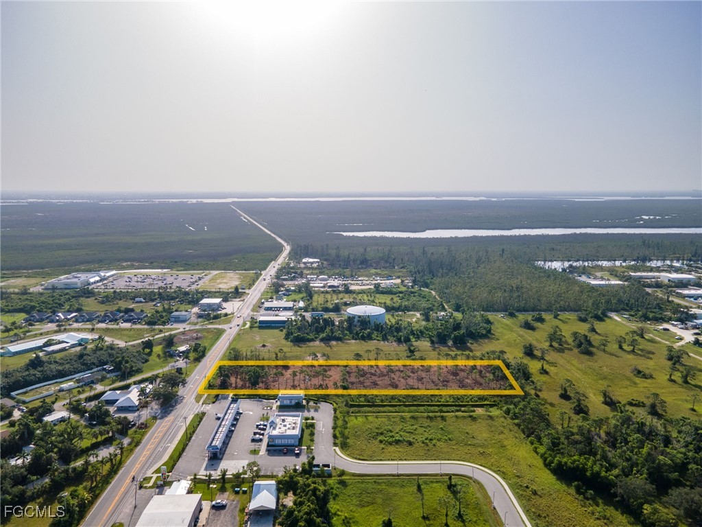 5401 Pine Island Road Bokeelia, FL 33922 - Photo 2 of 15 an aerial view of residential houses with outdoor space