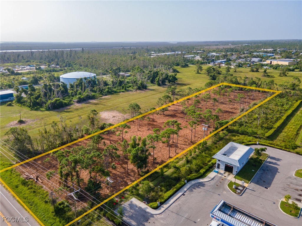 5401 Pine Island Road Bokeelia, FL 33922 - Photo 8 of 15 an aerial view of residential houses with outdoor space and river