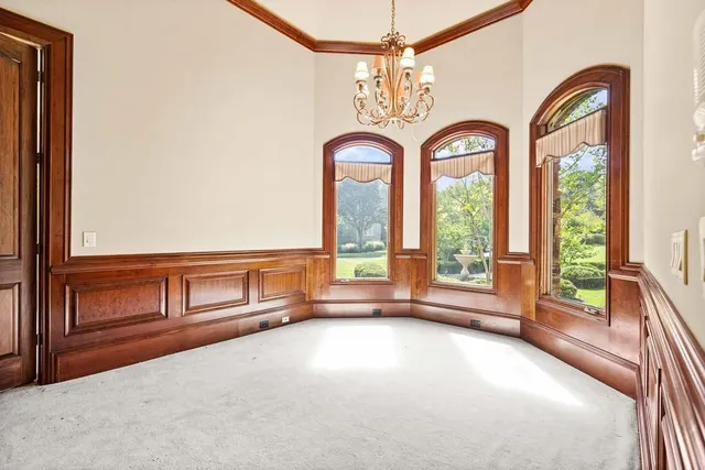 a bathroom with a sink mirror and a shower