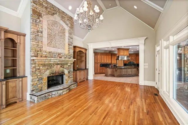 a bathroom with a granite countertop sink and a bathtub with shower