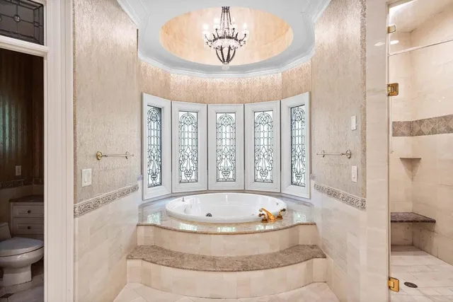 a bathroom with a double vanity sink mirror double vanity and bathtub