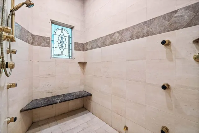 a view of a kitchen with a sink and a large window