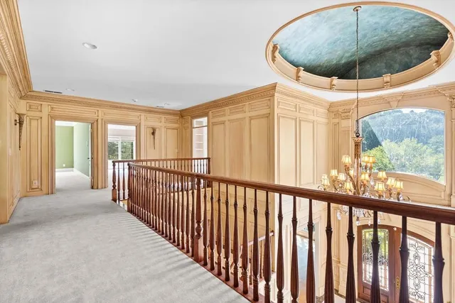 a view of an empty room and a window