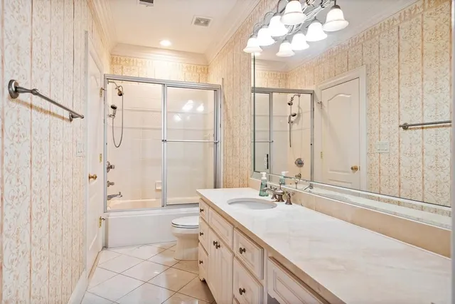 a white house with a large tree in front of it