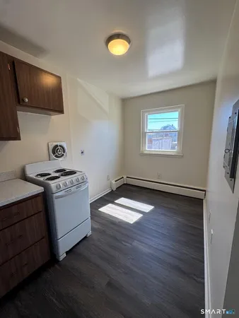 a kitchen with a stove and a microwave