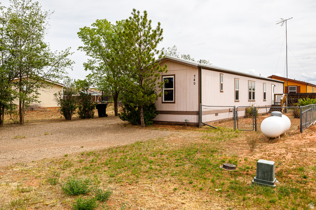 740 Riddle Drive Fredonia, AZ 86022 - Photo 15 of 20 Single-story residence featuring a neutral-toned exterior with contrasting trim and multiple windows