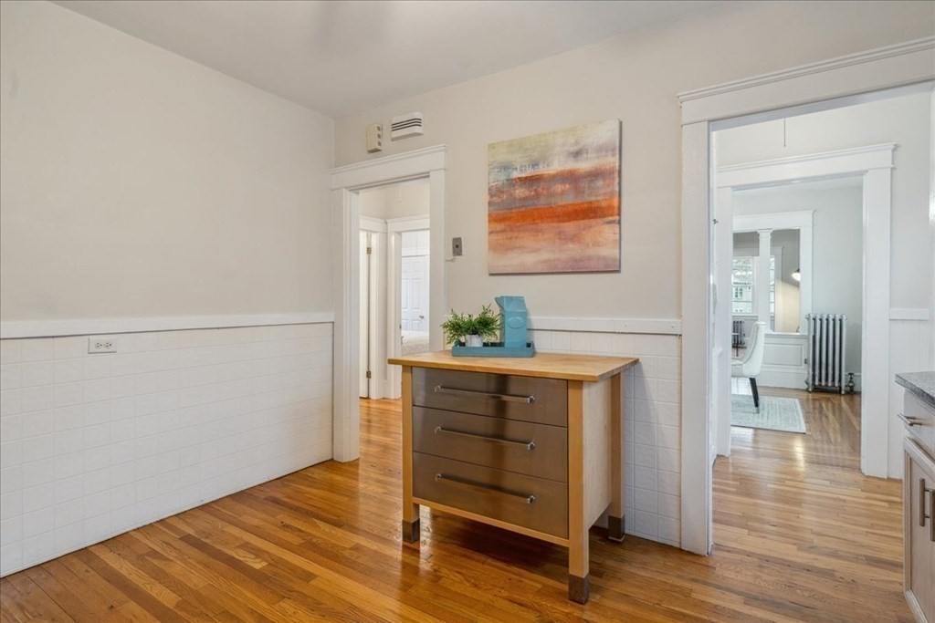 41 Blanchard Road, Unit 41 Cambridge, MA 02138 - Photo 11 of 36 a view of a hallway with wooden floor and cabinet