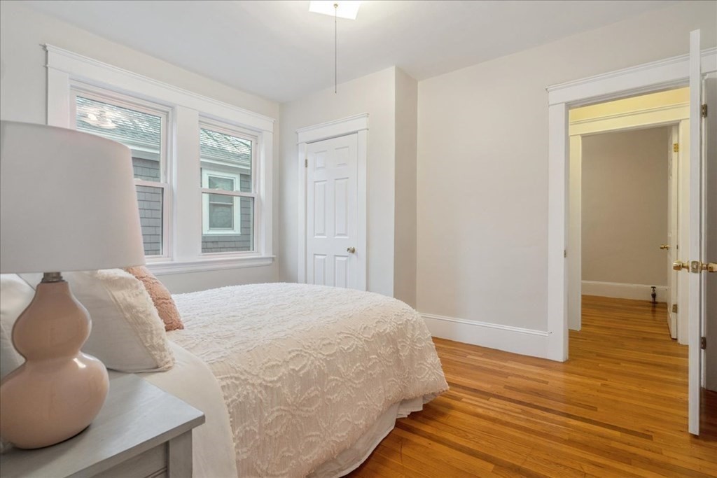41 Blanchard Road, Unit 41 Cambridge, MA 02138 - Photo 13 of 36 a bedroom with a bed and wooden floor