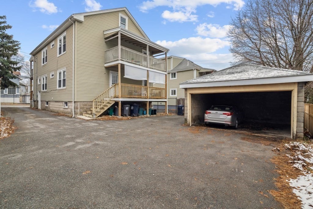 41 Blanchard Road, Unit 41 Cambridge, MA 02138 - Photo 20 of 36 a front view of a house with a yard and garage