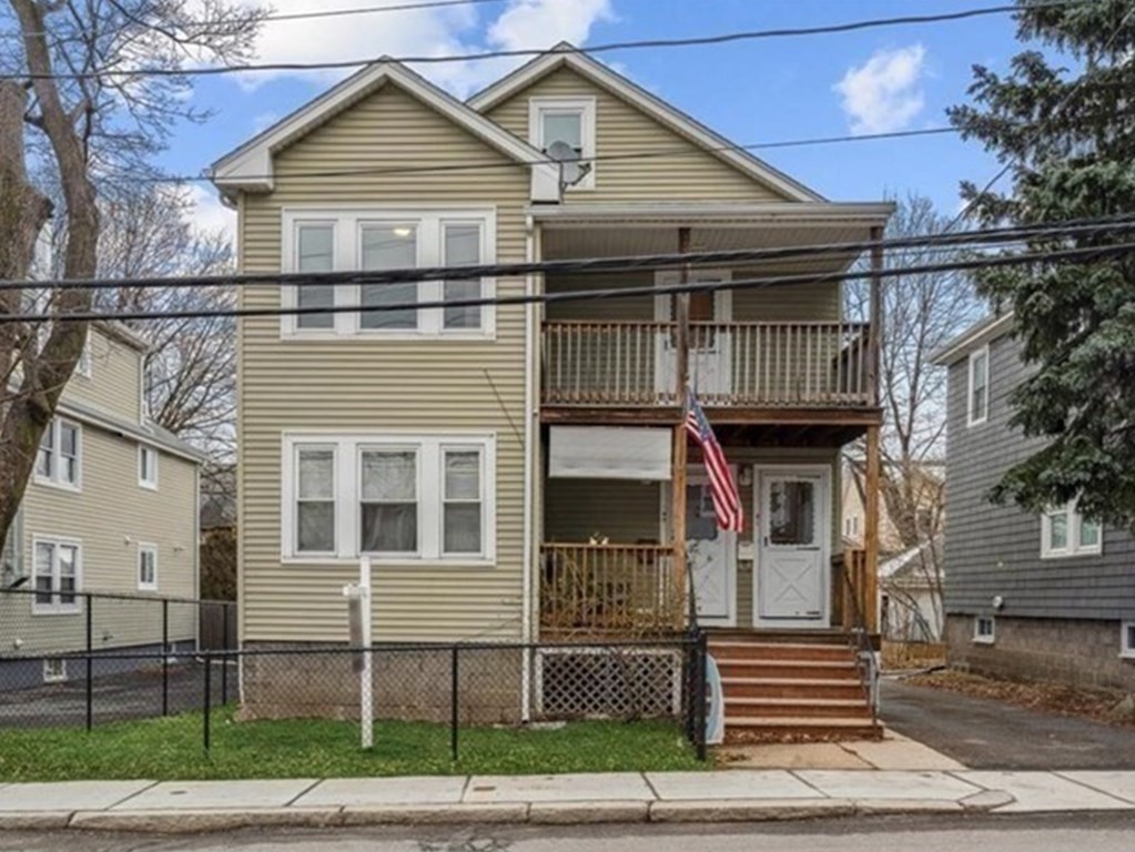 41 Blanchard Road, Unit 41 Cambridge, MA 02138 - Photo 23 of 36 a front view of a house with a yard and garage