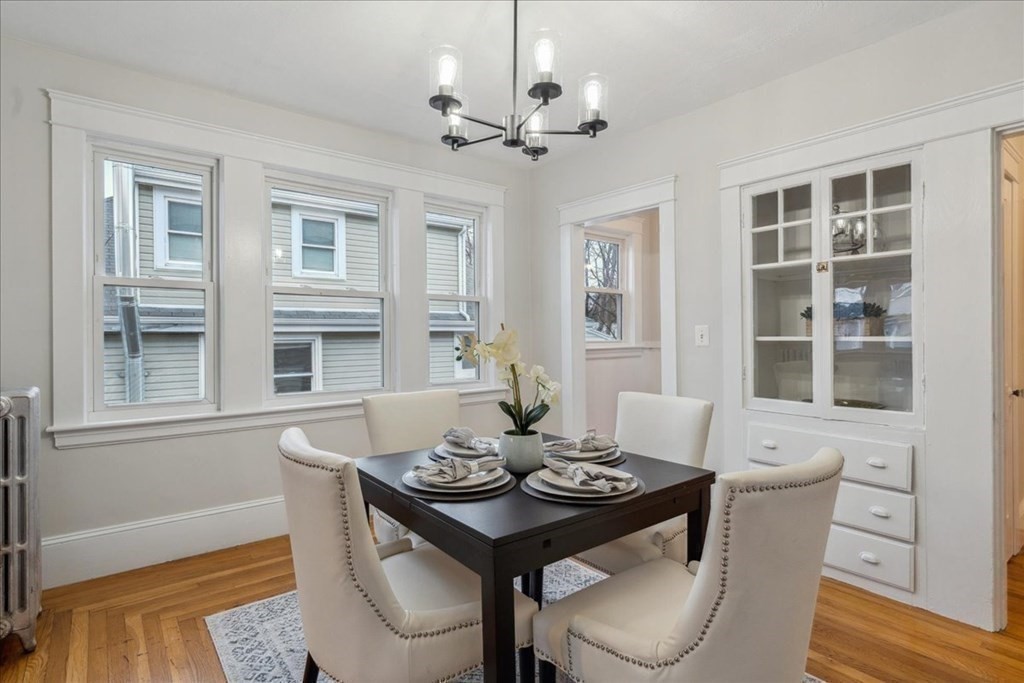 41 Blanchard Road, Unit 41 Cambridge, MA 02138 - Photo 7 of 36 a view of a dining room with furniture window and wooden floor