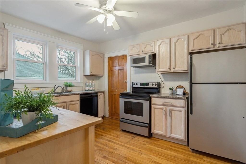 41 Blanchard Road, Unit 41 Cambridge, MA 02138 - Photo 8 of 36 a kitchen with granite countertop stainless steel appliances a counter space and a window