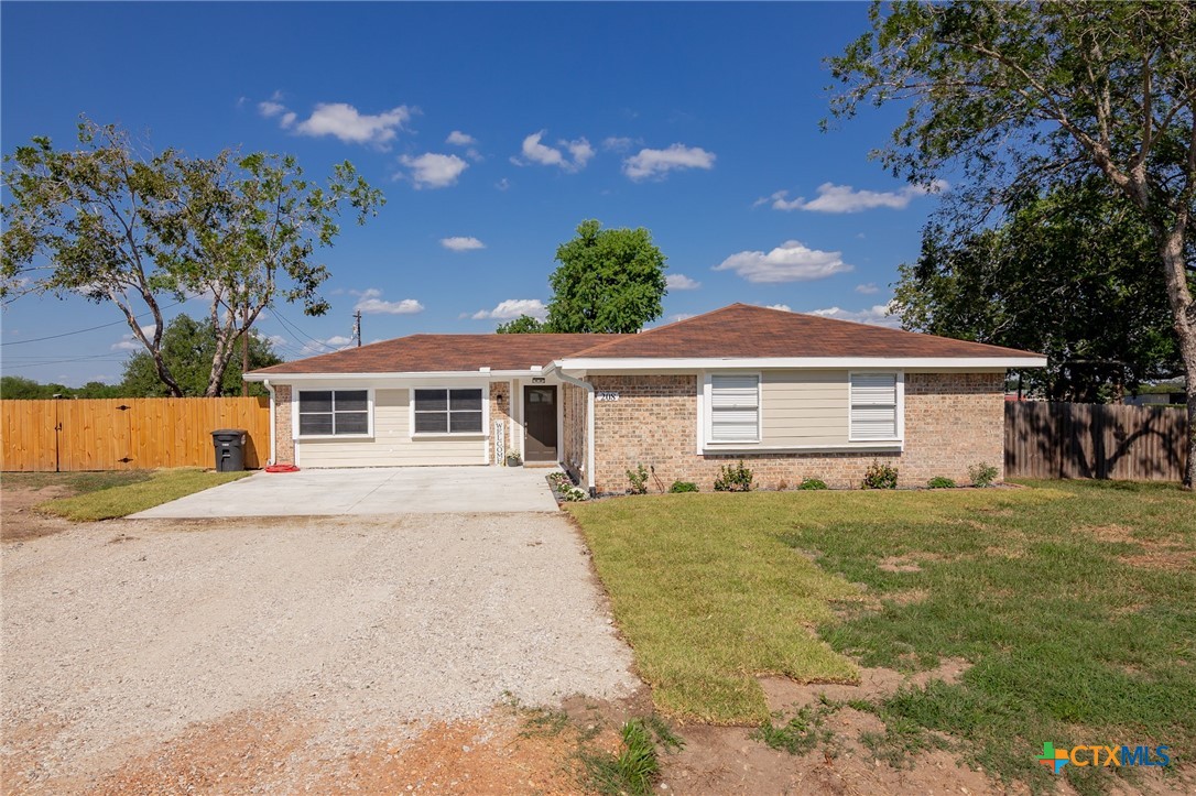 208 Eleanor Street Victoria, TX 77904 - Photo 2 of 40 a front view of a house with a yard and garage