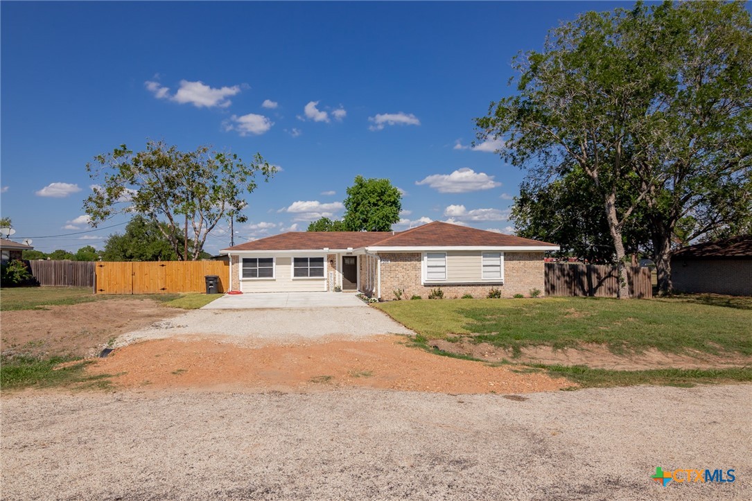 208 Eleanor Street Victoria, TX 77904 - Photo 3 of 40 a front view of a house with a garden and yard