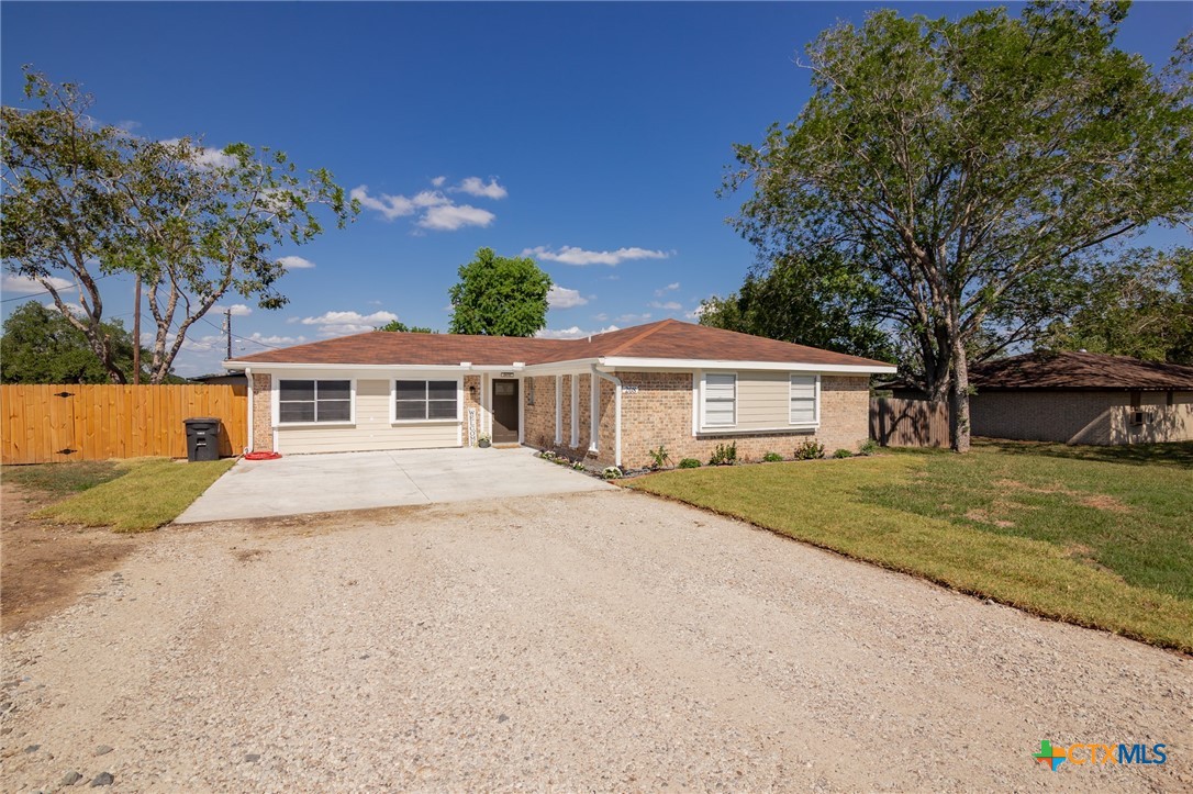 208 Eleanor Street Victoria, TX 77904 - Photo 4 of 40 a front view of a house with a yard and garage