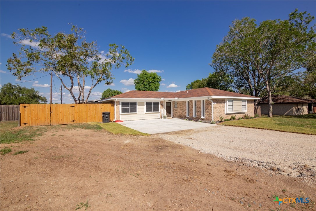 208 Eleanor Street Victoria, TX 77904 - Photo 5 of 40 a front view of a house with a yard and garage