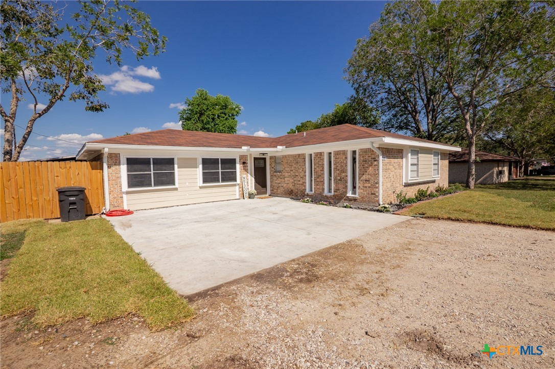 208 Eleanor Street Victoria, TX 77904 - Photo 6 of 40 a front view of a house with a yard and potted plants