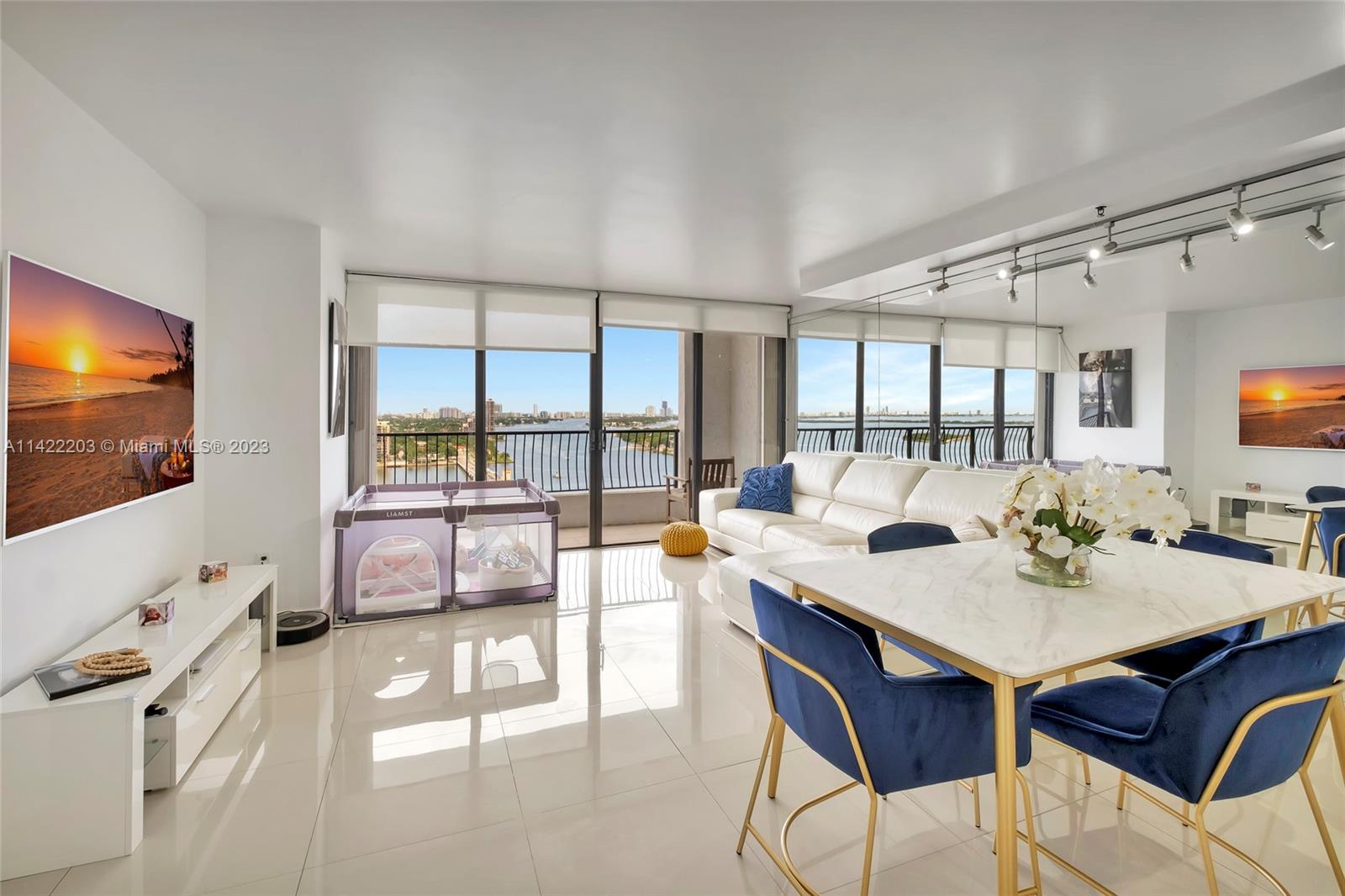 555 Northeast 15th Street, Unit 20B Miami, FL 33132 - Photo 1 of 33 a view of a dining room with furniture and a flat screen tv