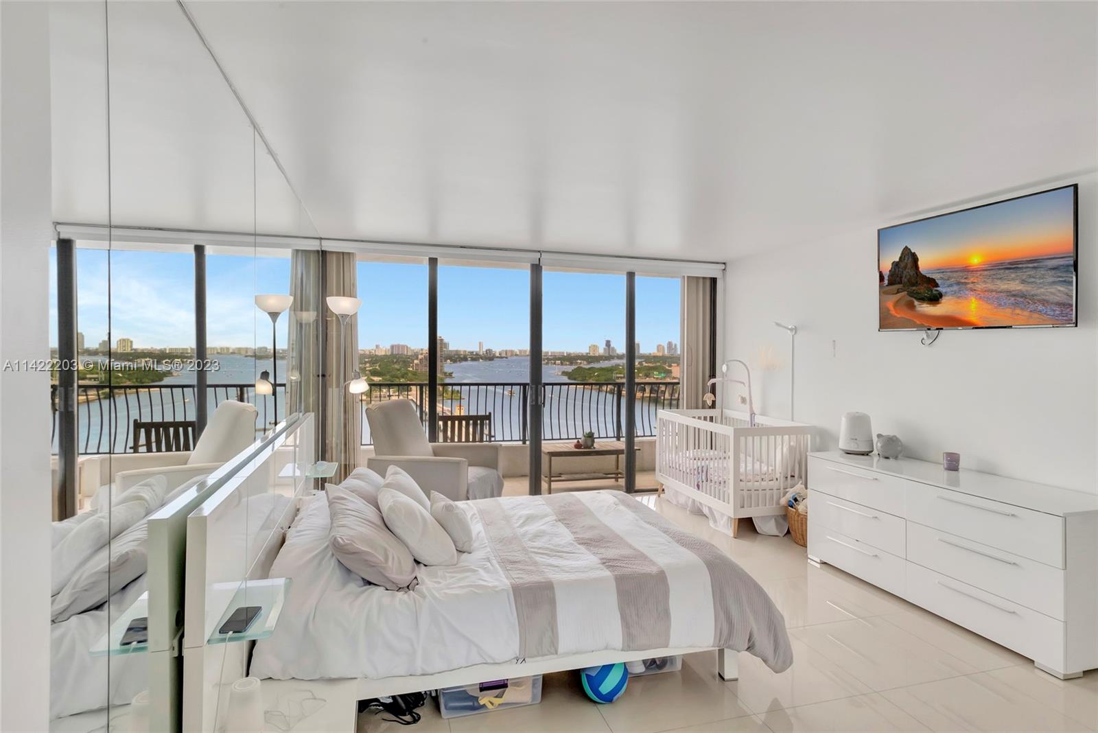555 Northeast 15th Street, Unit 20B Miami, FL 33132 - Photo 11 of 33 a bedroom with a bed and a large window