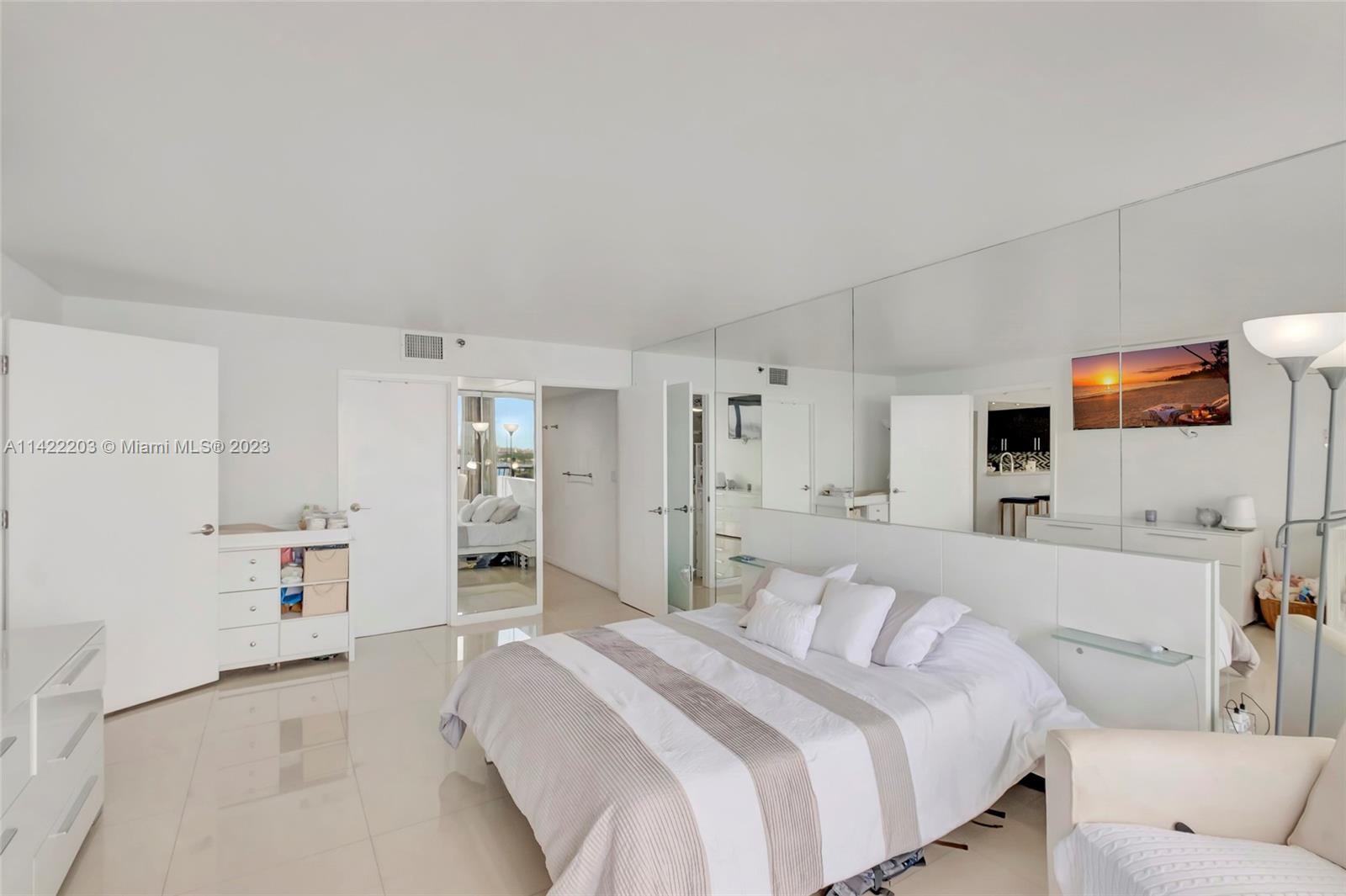 555 Northeast 15th Street, Unit 20B Miami, FL 33132 - Photo 12 of 33 a bedroom with a bed and a couch