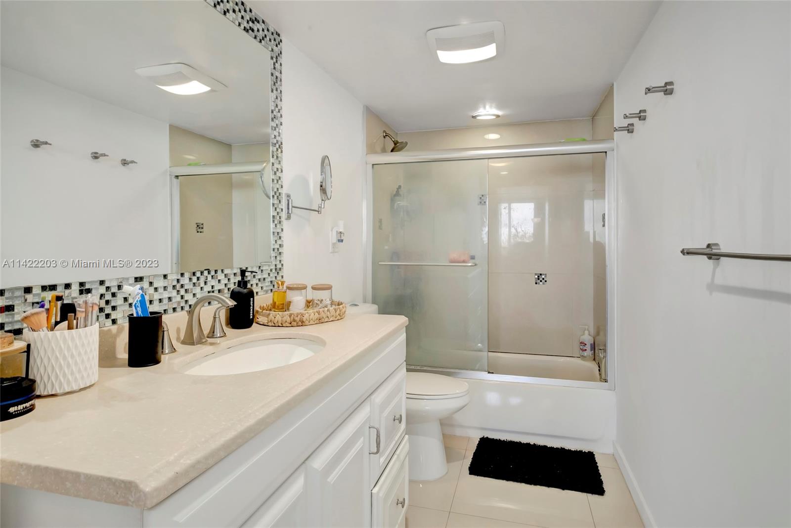 555 Northeast 15th Street, Unit 20B Miami, FL 33132 - Photo 13 of 33 a bathroom with a sink a toilet and shower