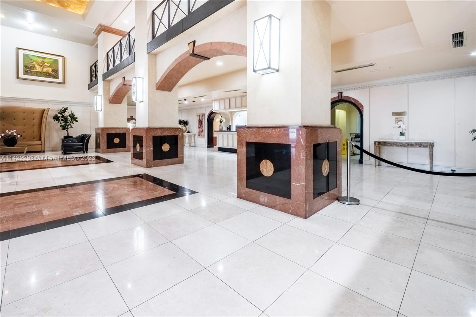 555 Northeast 15th Street, Unit 20B Miami, FL 33132 - Photo 23 of 33 a living room with furniture a fireplace and a counter top space
