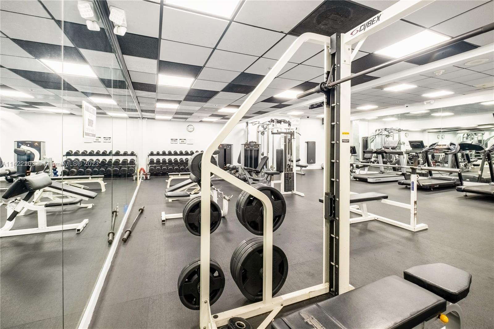 555 Northeast 15th Street, Unit 20B Miami, FL 33132 - Photo 25 of 33 a view of a room with gym equipment