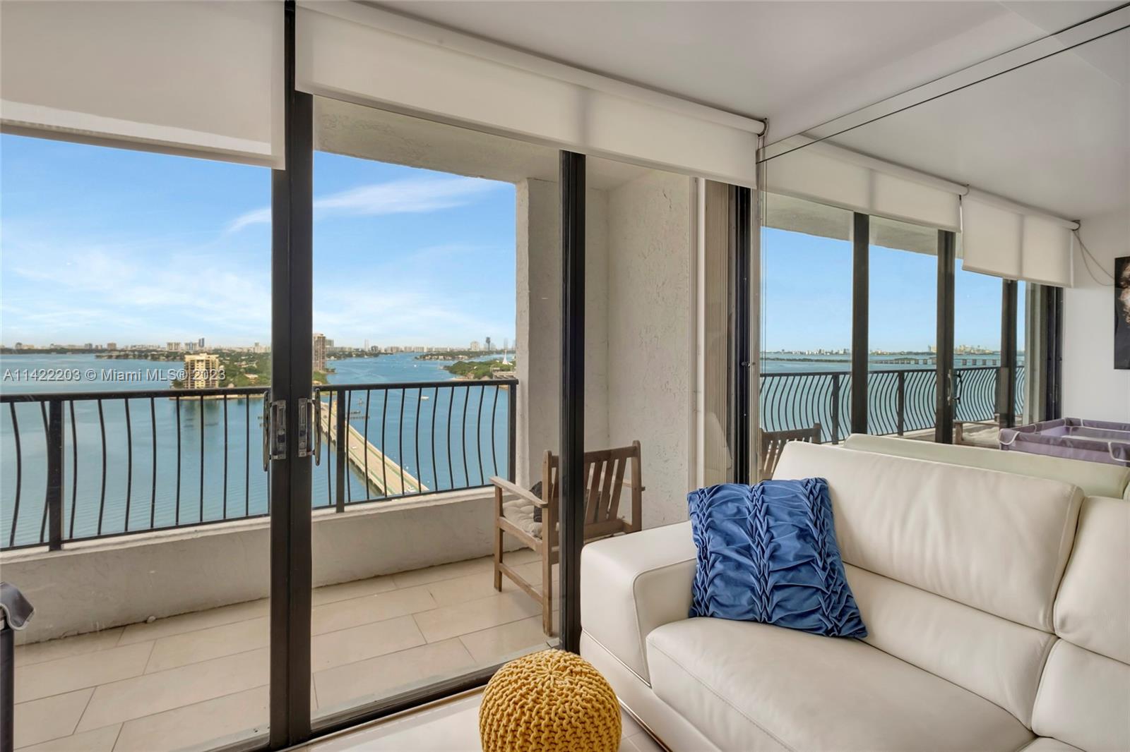 555 Northeast 15th Street, Unit 20B Miami, FL 33132 - Photo 7 of 33 a living room with furniture and floor to ceiling windows