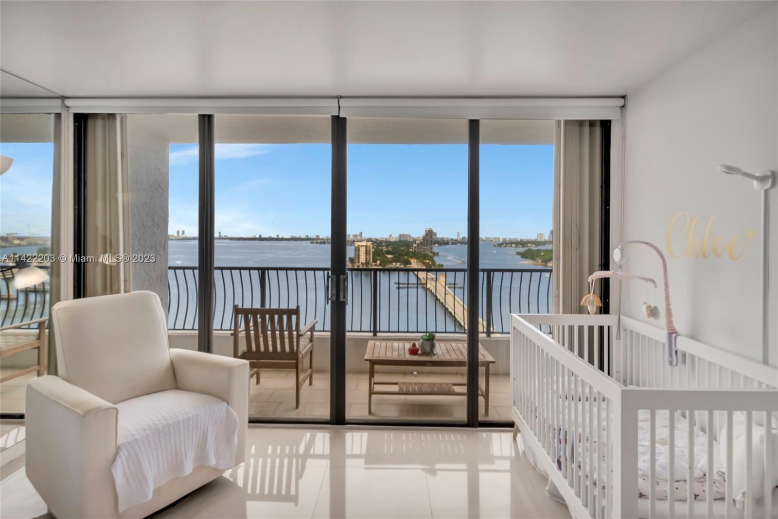 555 Northeast 15th Street, Unit 20B Miami, FL 33132 - Photo 9 of 33 a balcony with furniture and a large window