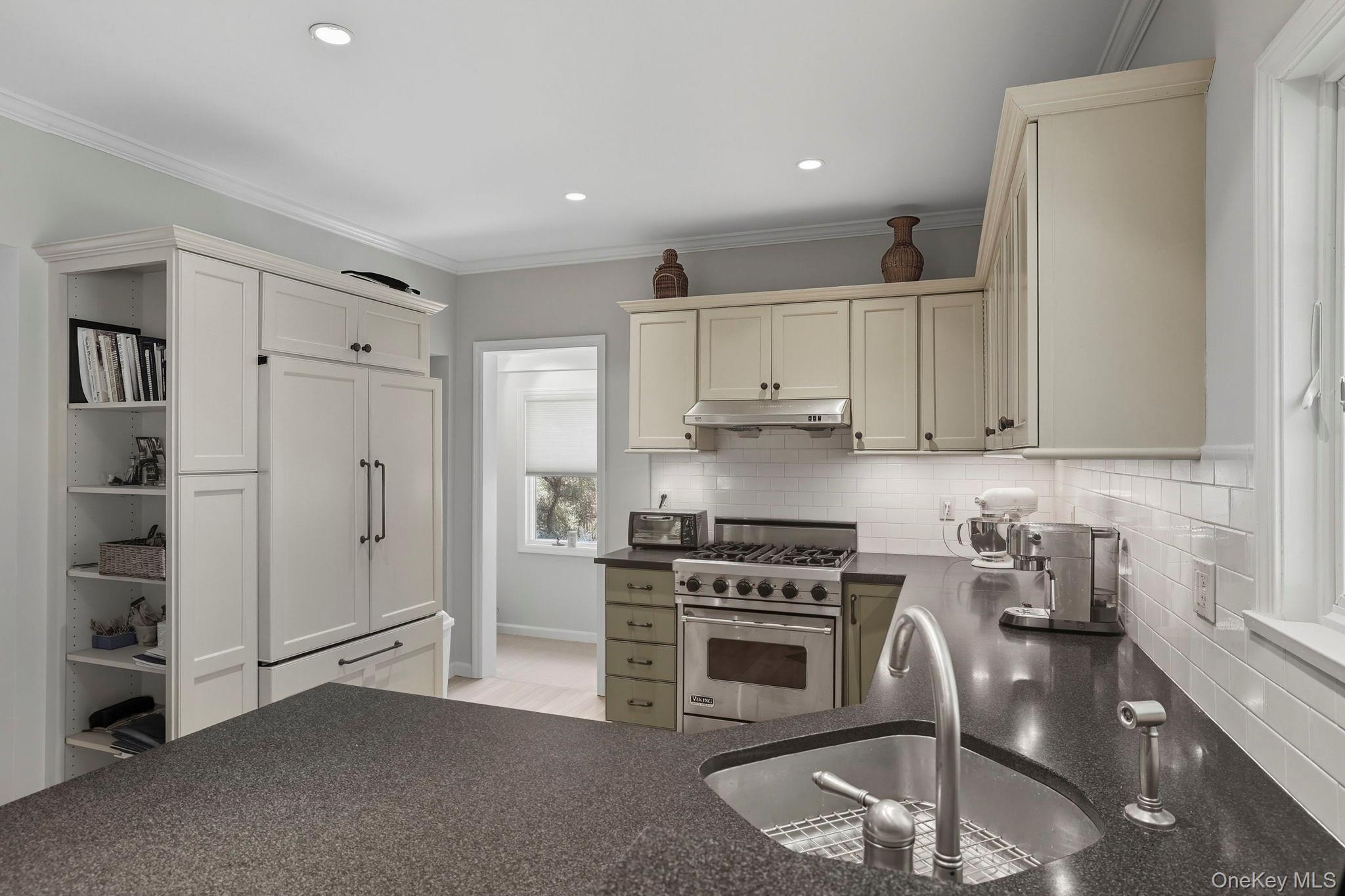 122 Harriman Road Mount Kisco, NY 10549 - Photo 11 of 39 a kitchen with stainless steel appliances granite countertop a stove a refrigerator and a sink
