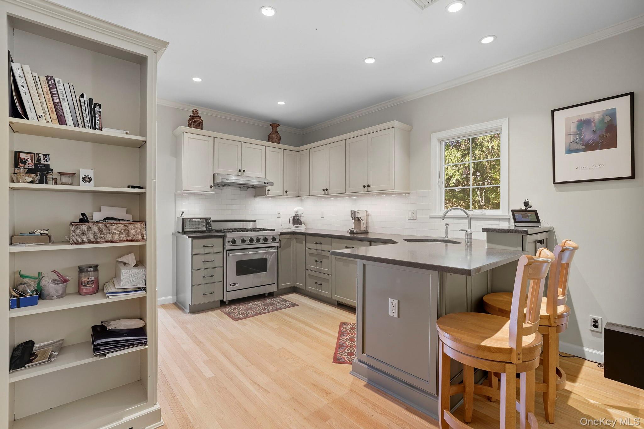 122 Harriman Road Mount Kisco, NY 10549 - Photo 12 of 39 a kitchen with granite countertop a sink cabinets and stainless steel appliances