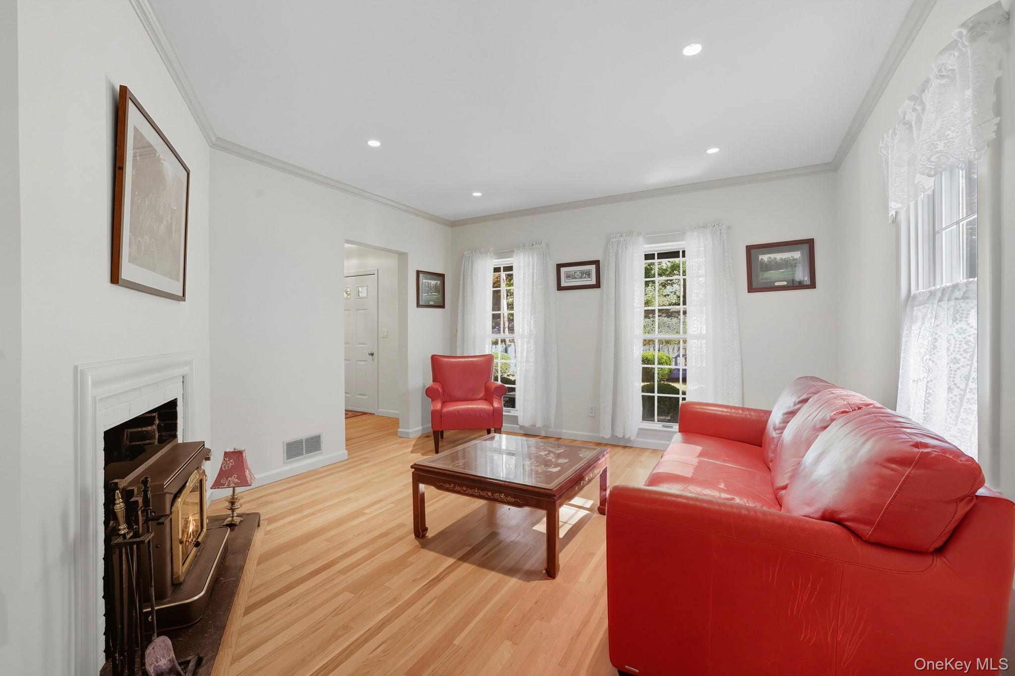 122 Harriman Road Mount Kisco, NY 10549 - Photo 14 of 39 a living room with furniture a fireplace