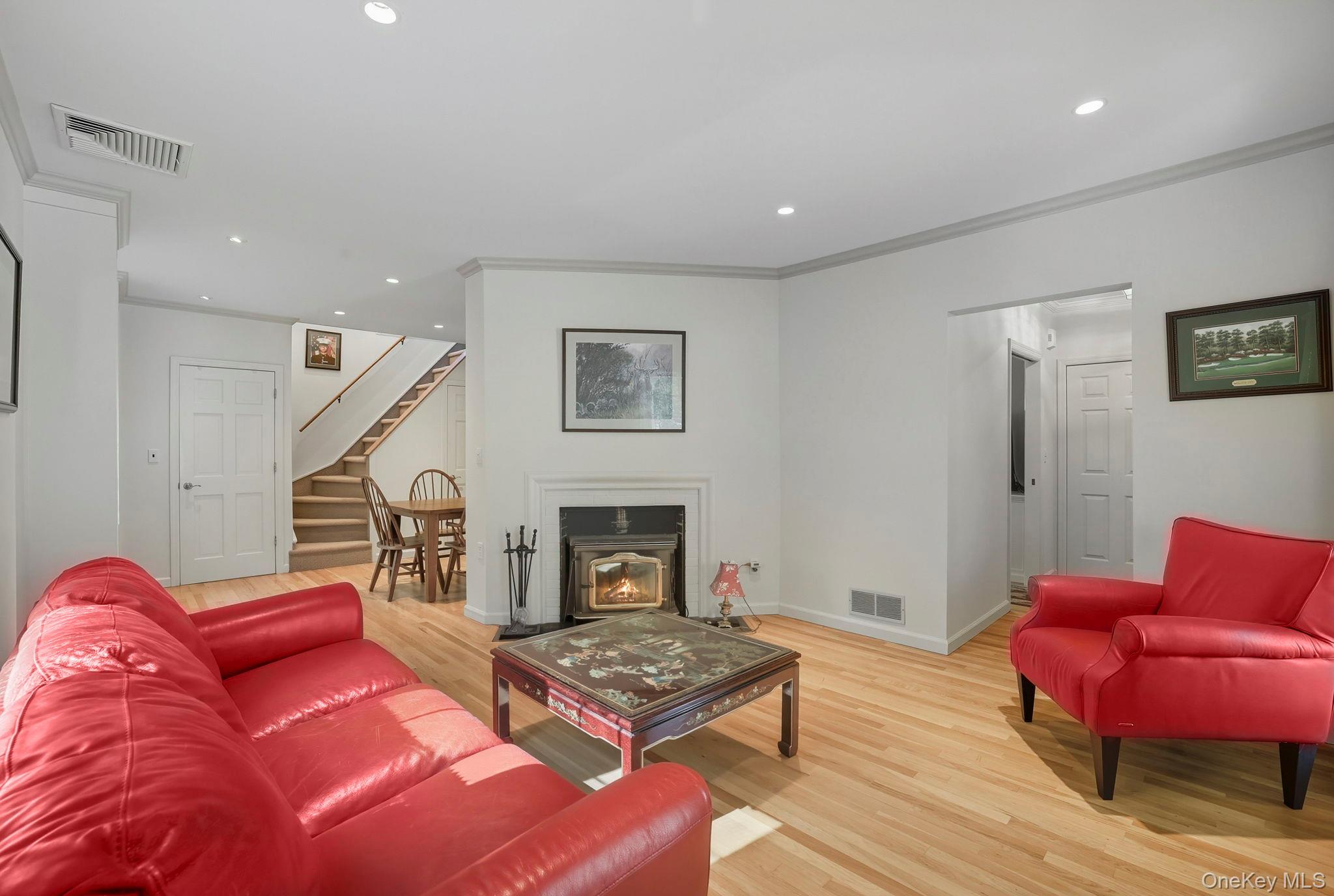 122 Harriman Road Mount Kisco, NY 10549 - Photo 15 of 39 a living room with furniture and a fireplace