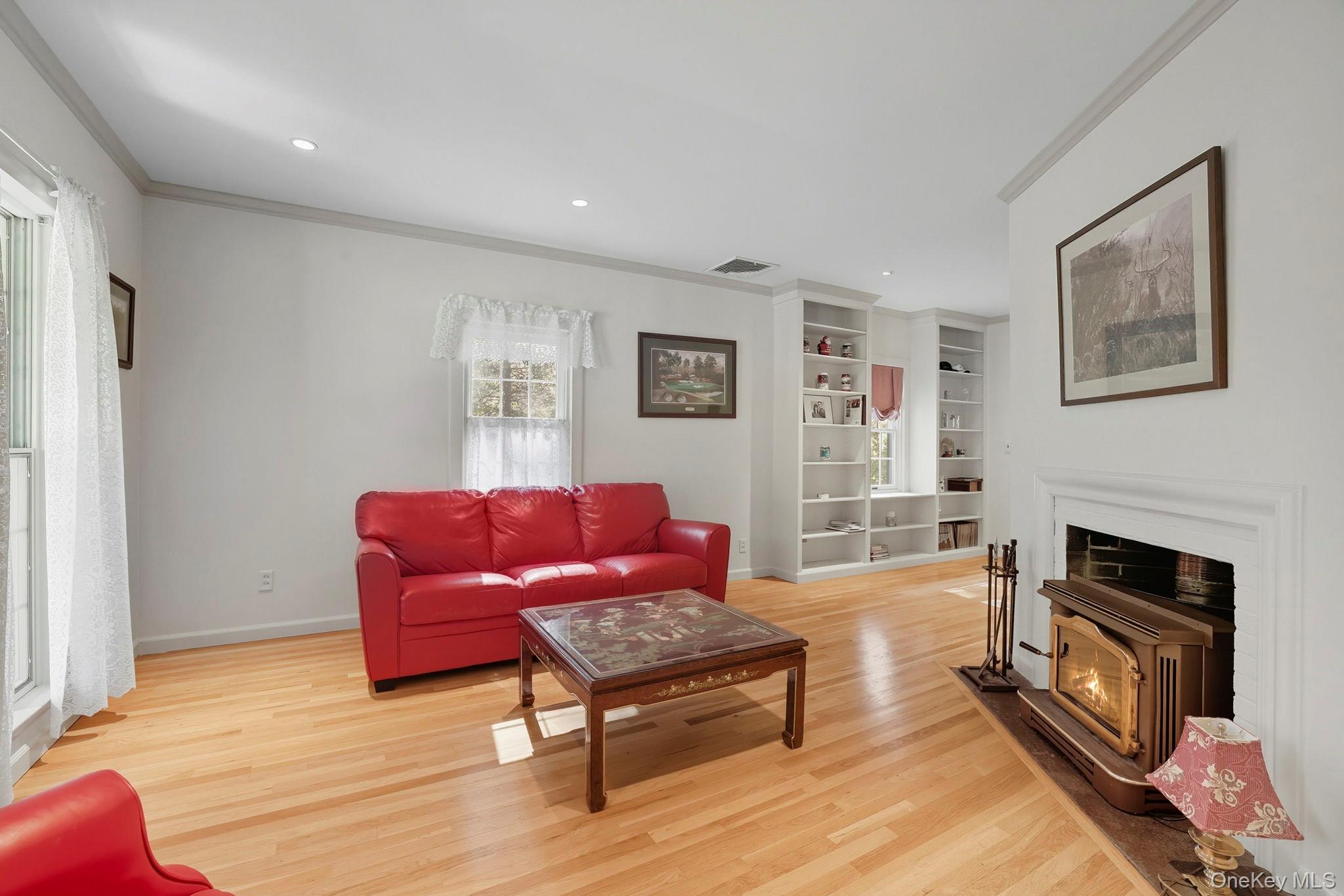 122 Harriman Road Mount Kisco, NY 10549 - Photo 16 of 39 a living room with furniture and a fireplace