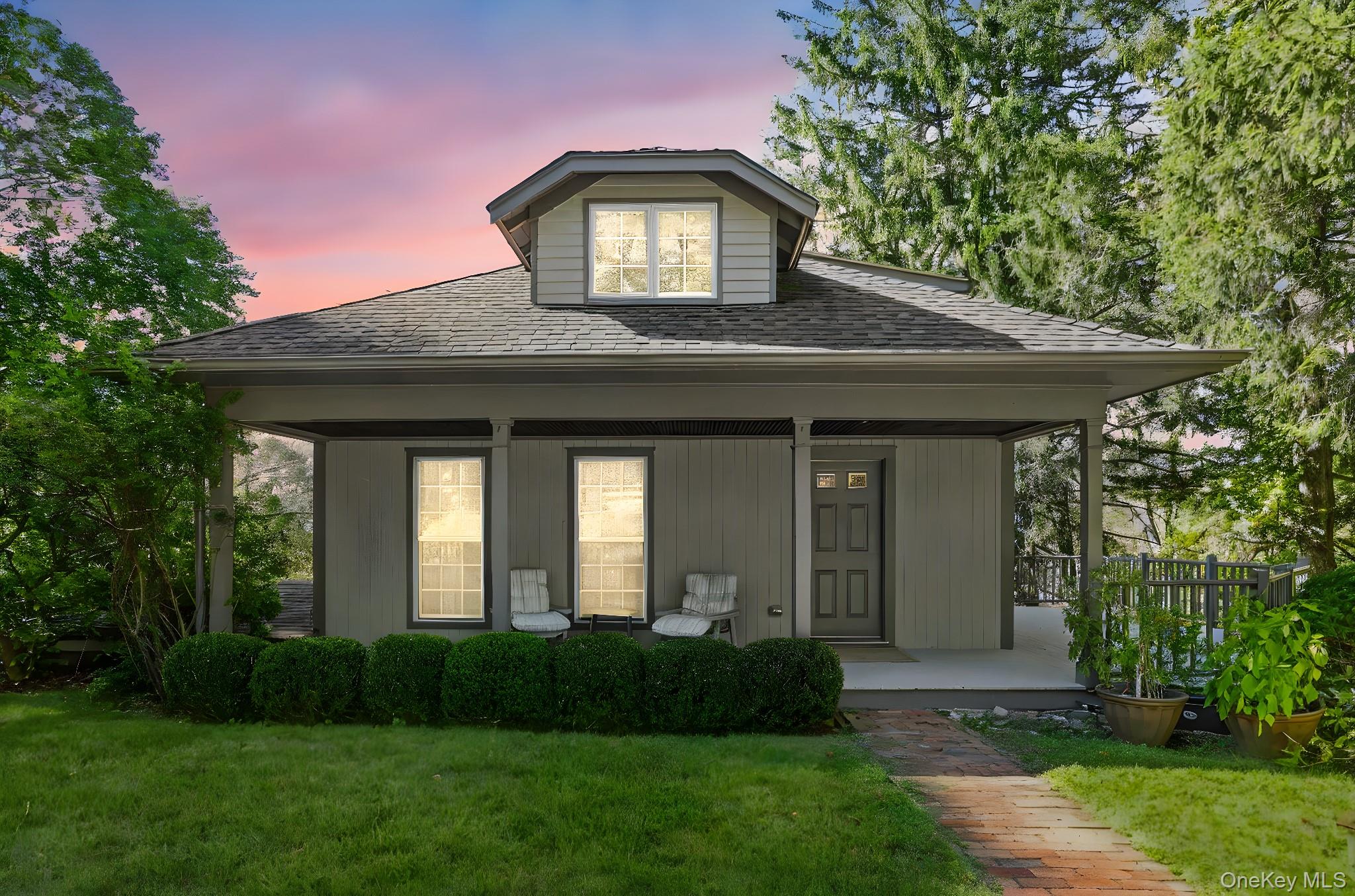 122 Harriman Road Mount Kisco, NY 10549 - Photo 2 of 39 a front view of a house with a garden