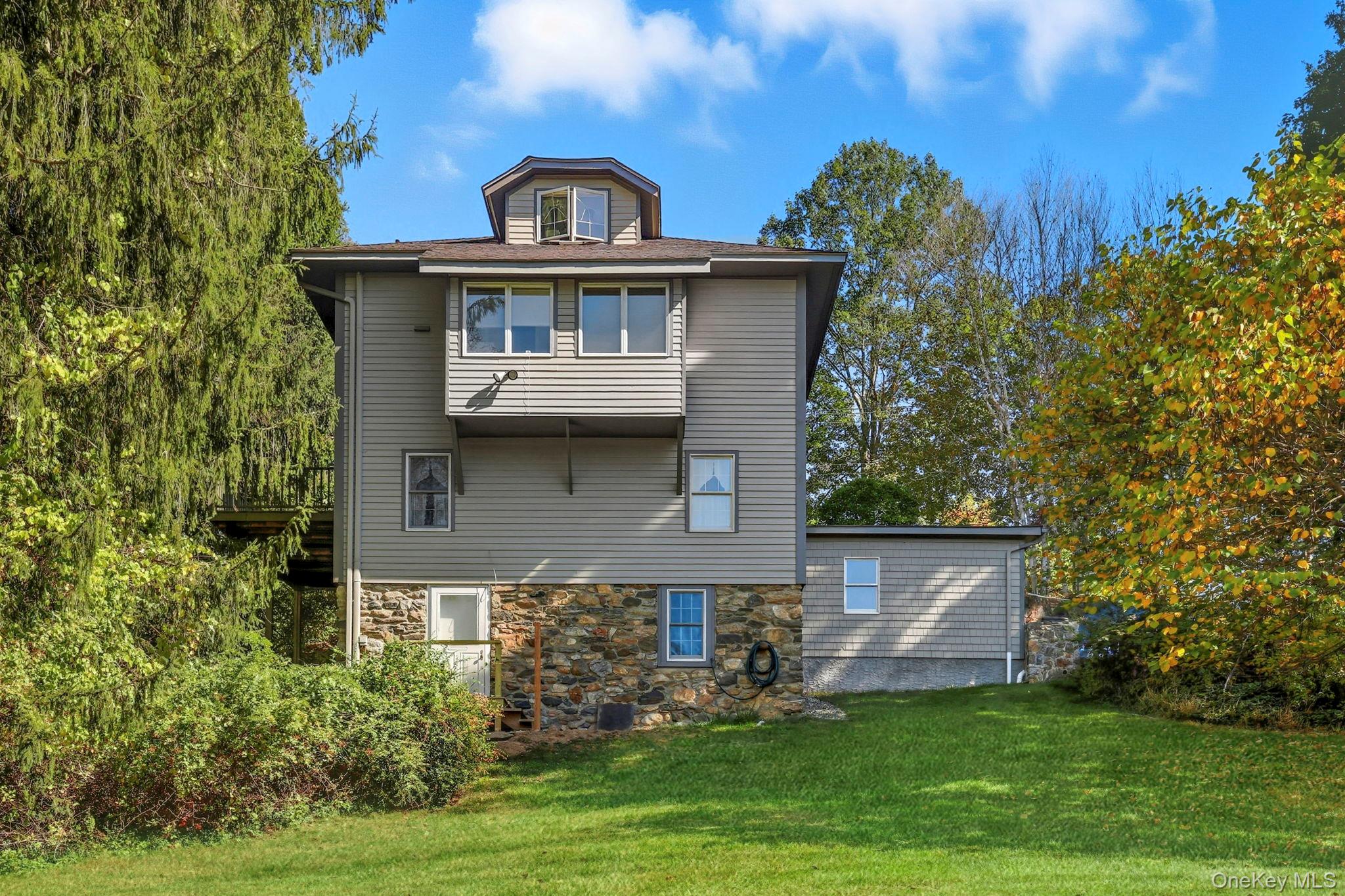 122 Harriman Road Mount Kisco, NY 10549 - Photo 3 of 39 front view of a house with a yard