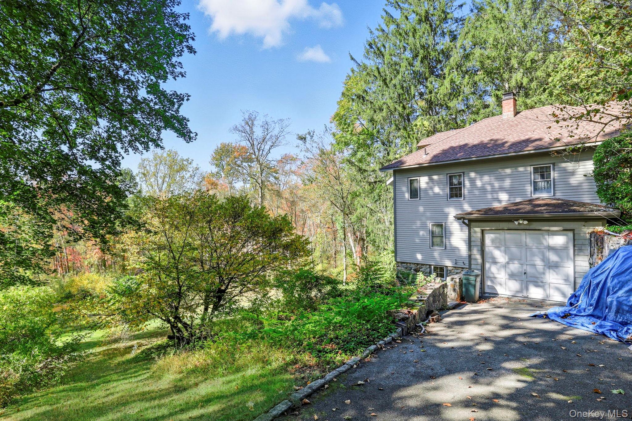 122 Harriman Road Mount Kisco, NY 10549 - Photo 33 of 39 a front view of a house with a yard