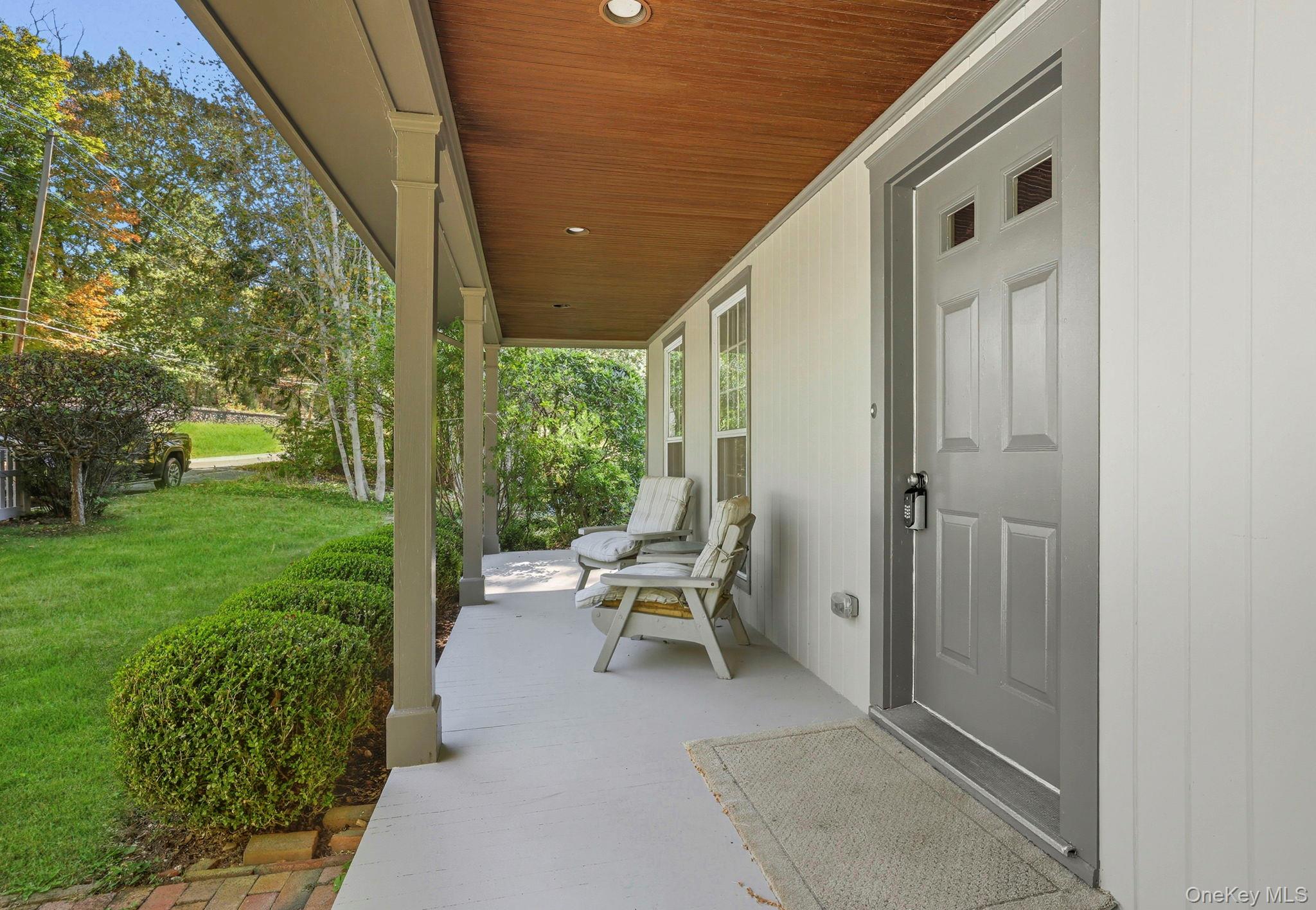 122 Harriman Road Mount Kisco, NY 10549 - Photo 4 of 39 a view of a porch with chairs and backyard