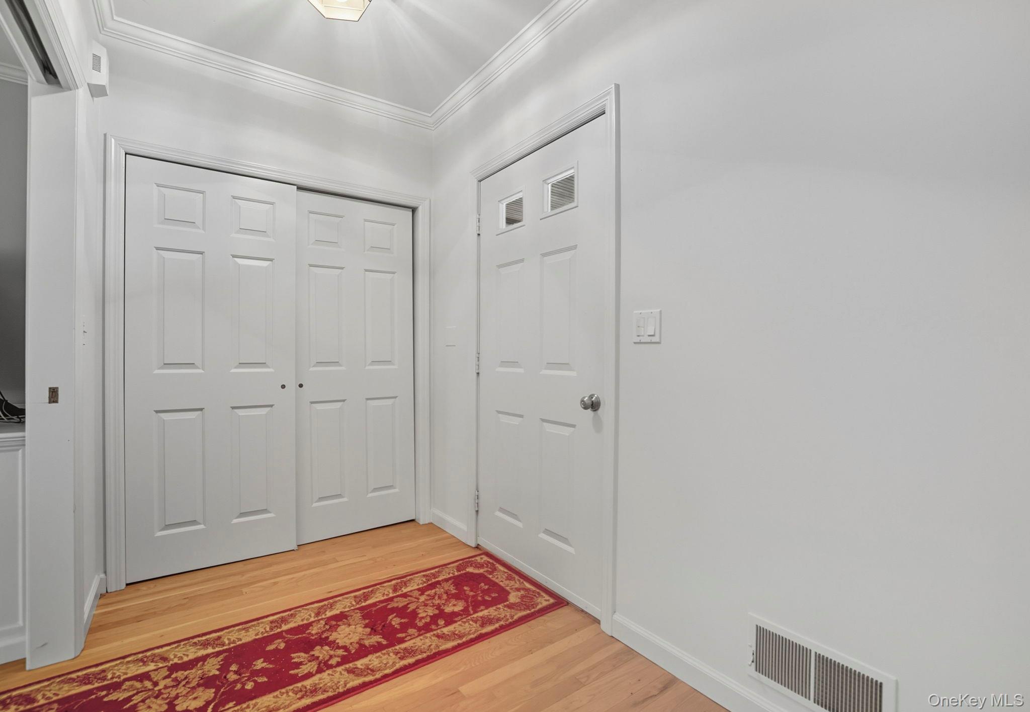 122 Harriman Road Mount Kisco, NY 10549 - Photo 7 of 39 a view of a room with wooden floor and closet