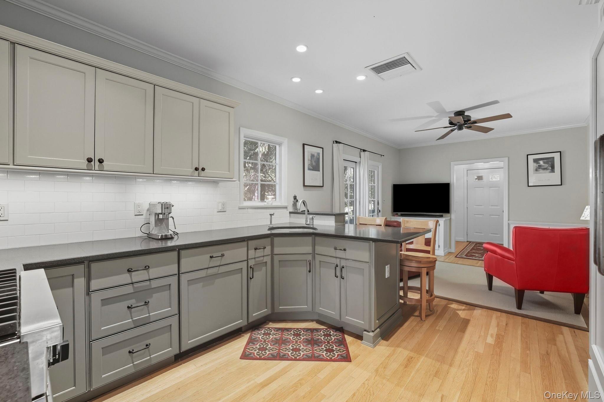 122 Harriman Road Mount Kisco, NY 10549 - Photo 8 of 39 a kitchen with stainless steel appliances granite countertop a sink and cabinets