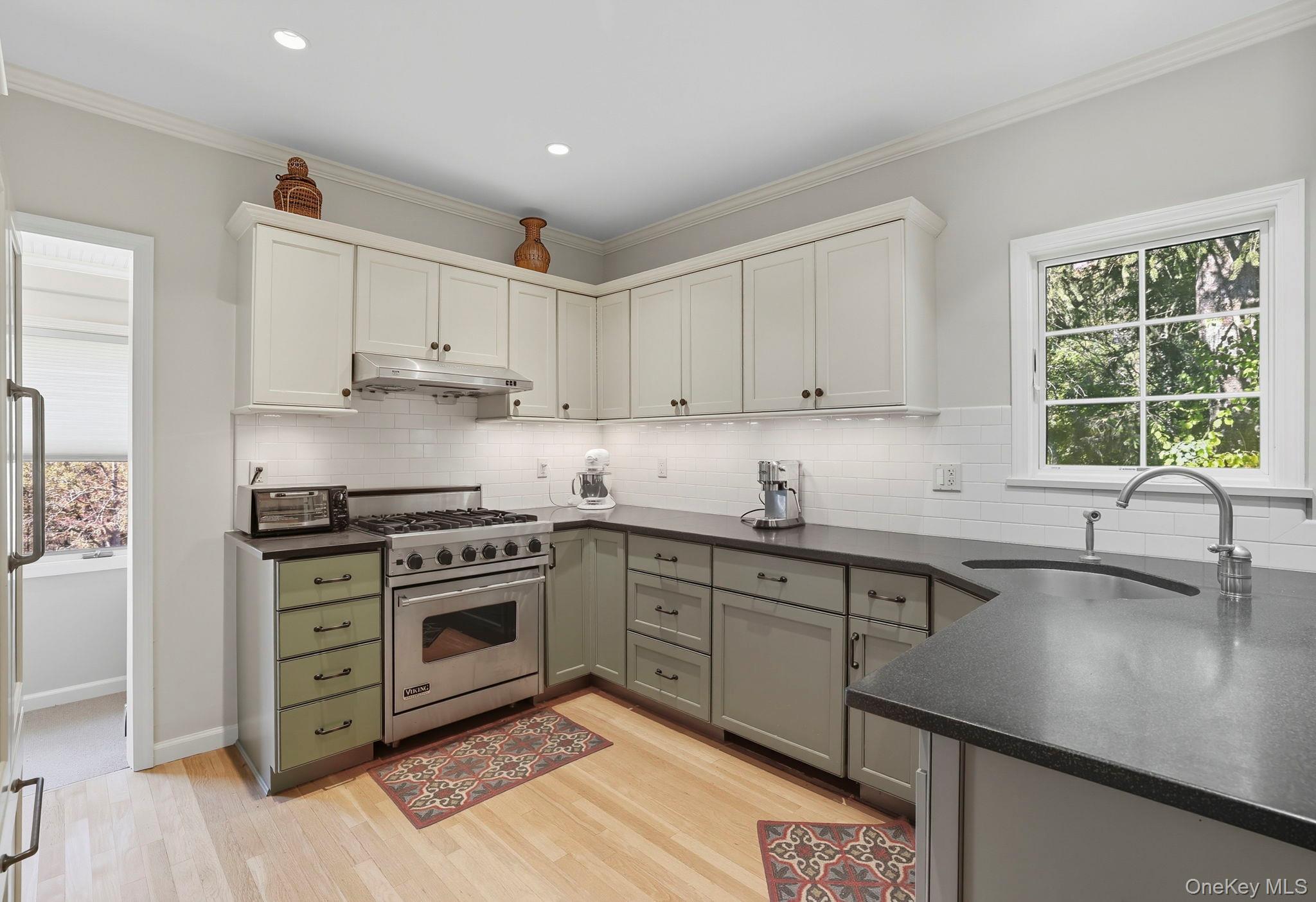 122 Harriman Road Mount Kisco, NY 10549 - Photo 9 of 39 a kitchen with appliances cabinets and a sink