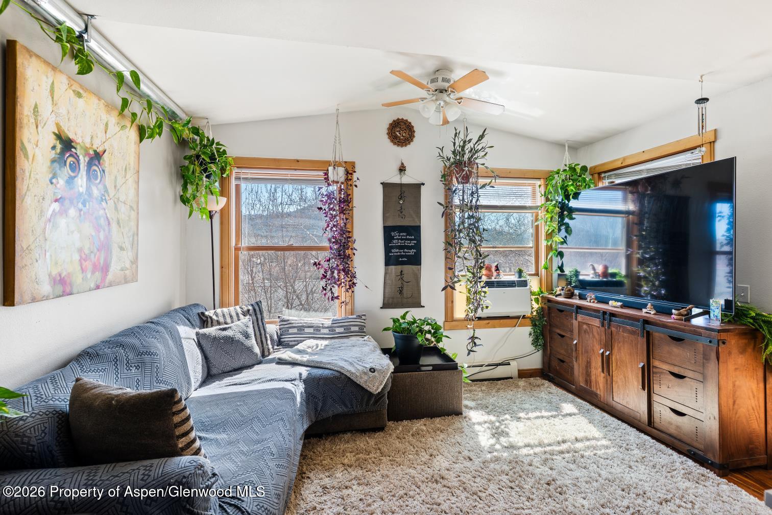 682 Alder Ridge Lane New Castle, CO 81647 - Photo 5 of 19 a living room with furniture large window and flat screen tv