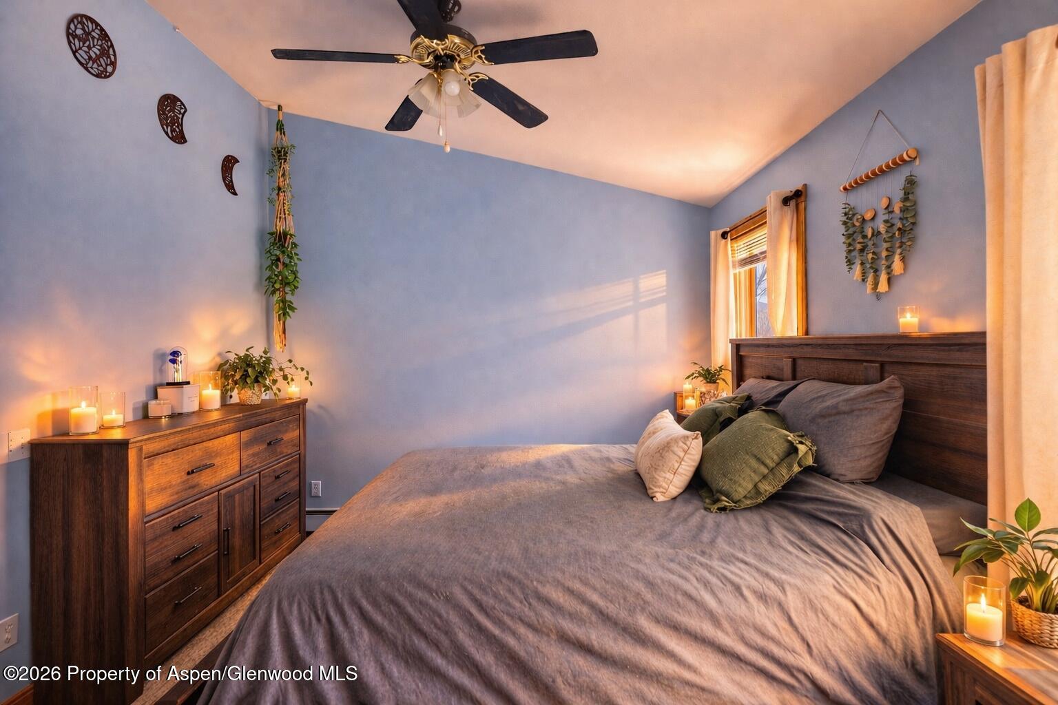 682 Alder Ridge Lane New Castle, CO 81647 - Photo 9 of 19 a bedroom with a bed and wooden floor