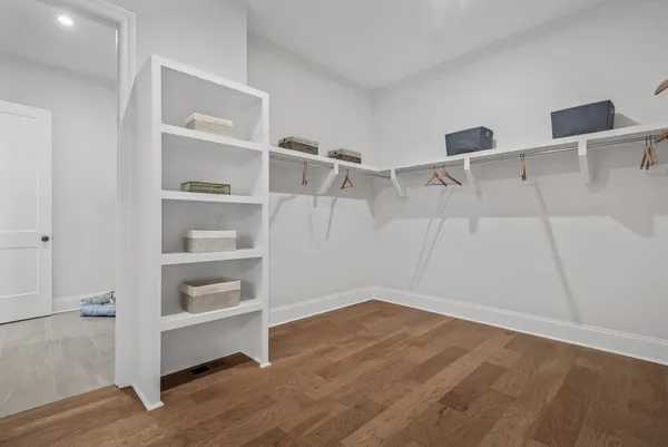 a view of an empty walk in closet