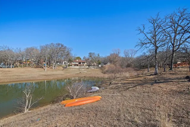 a view of yard covered with snow in front of house
