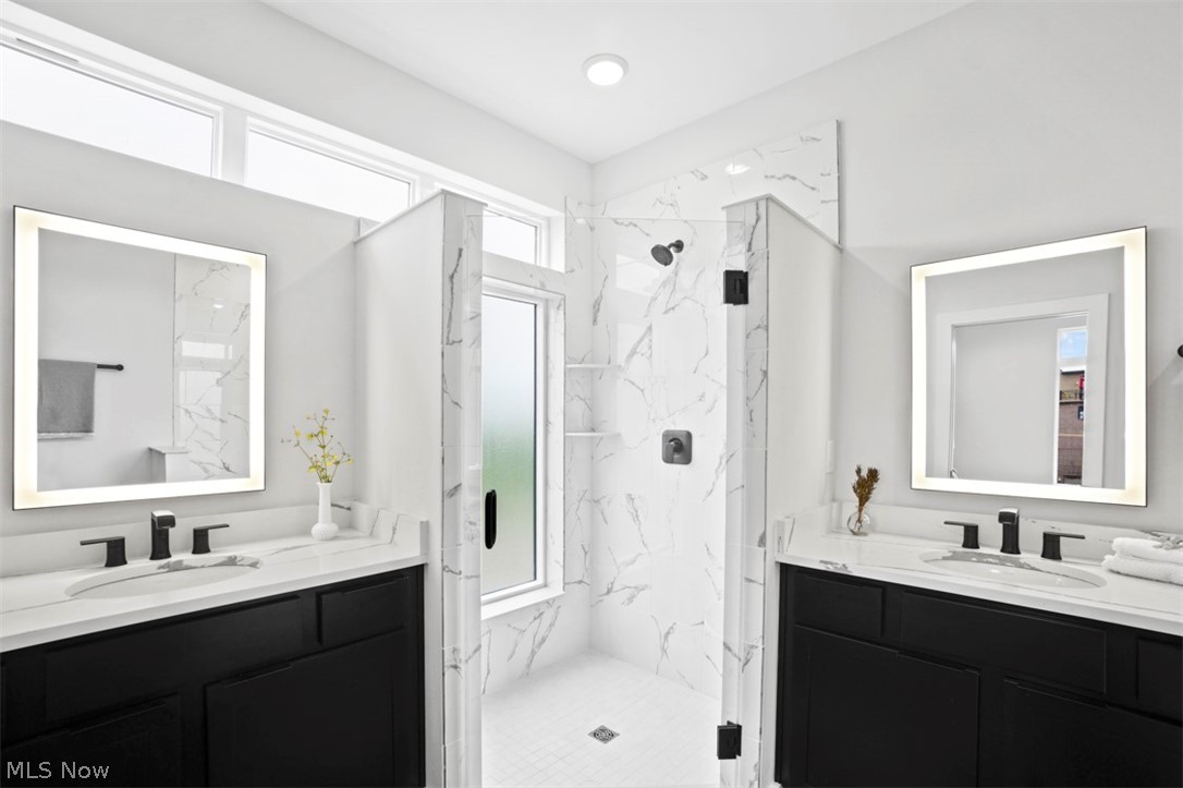 2291 West 19th Street Cleveland, OH 44113 - Photo 23 of 47 Bathroom with dual vanity and a shower with door