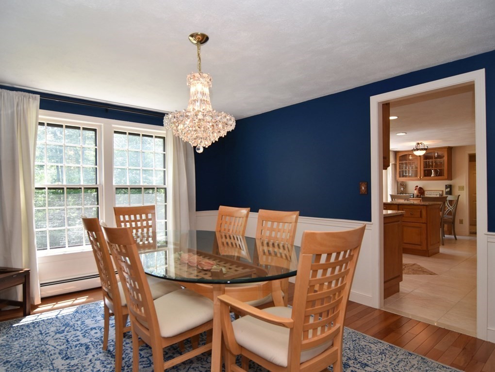 3 Violet Circle Milford, MA 01757 - Photo 12 of 41 a view of a dining room with furniture wooden floor and chandelier